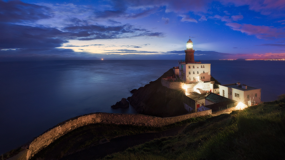 Morning with view on Baily Lighthouse at blue hour