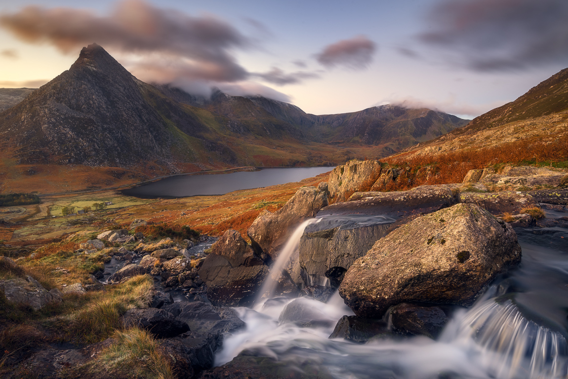 Sunrise with nature falls with view on Tryfan mountain in Snowdonia