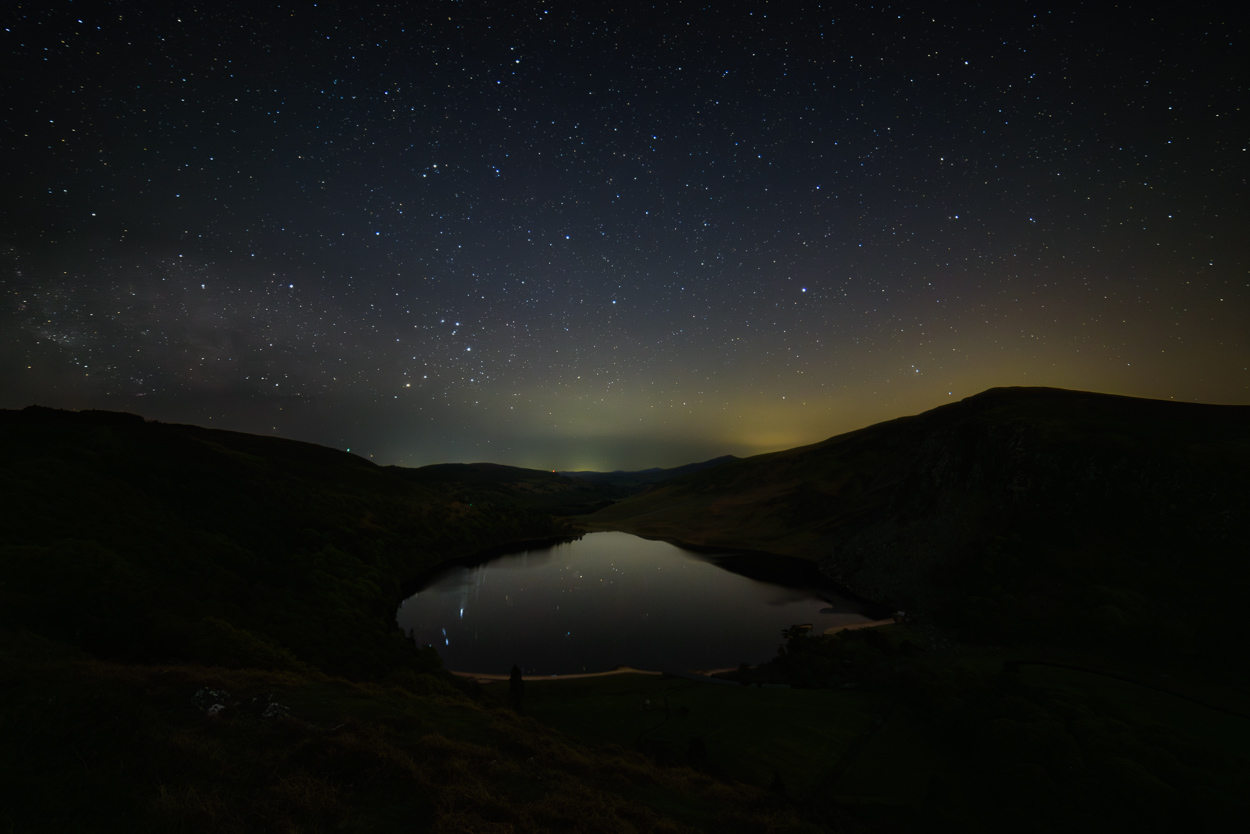 Night sky with Milky Way above Lough Tay in Wicklow Mountains